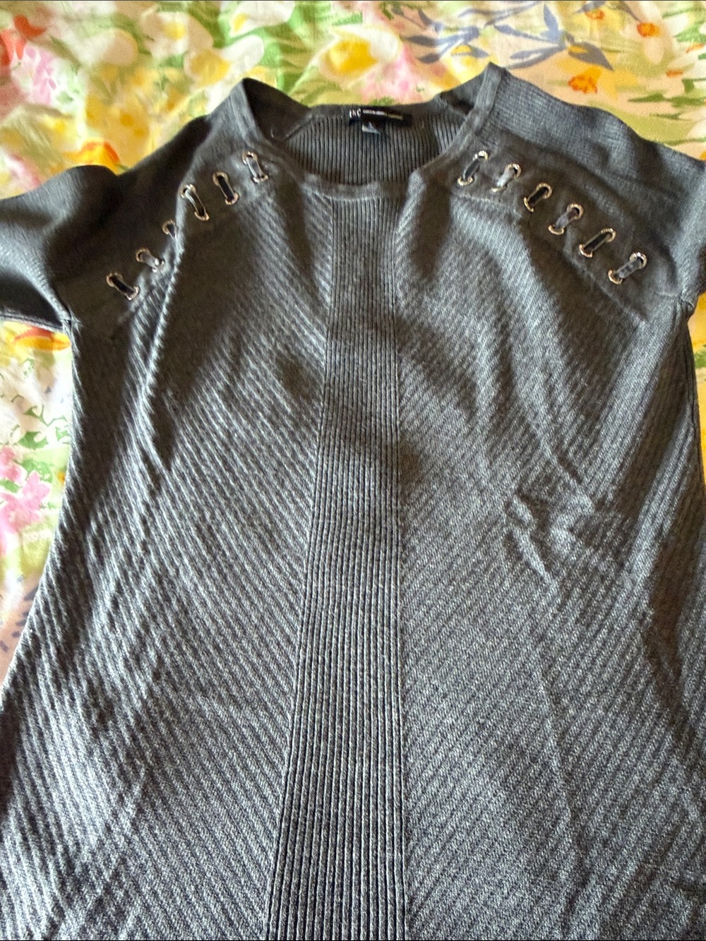 This is INC gray sweater with bling and velvet ribbons in the front size. Small